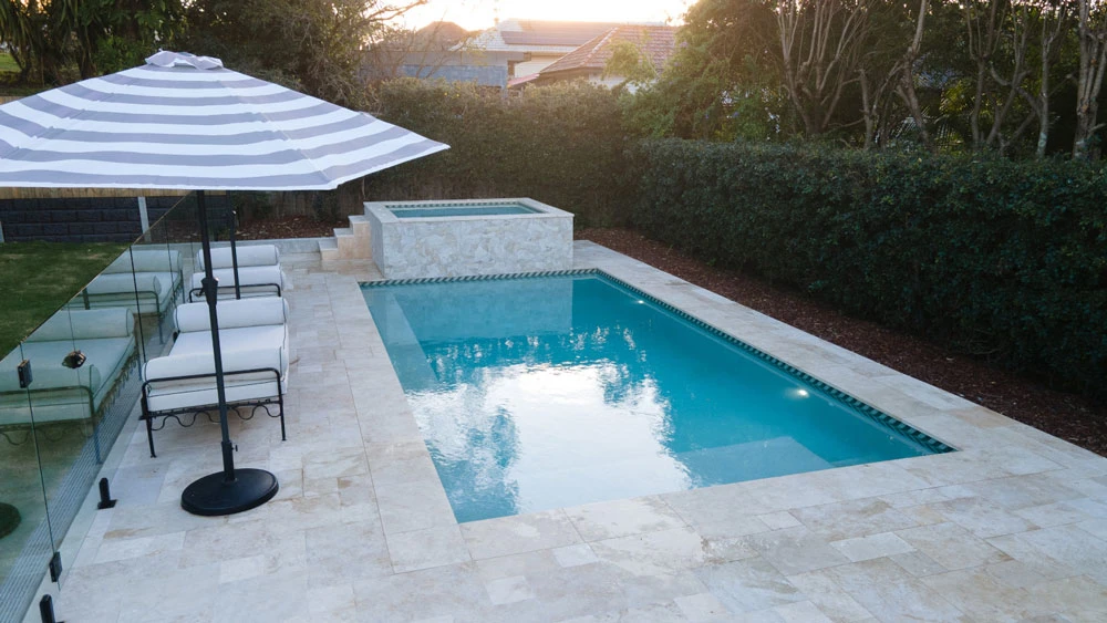 Fully tiled plunge pool set into a hardwood timber deck